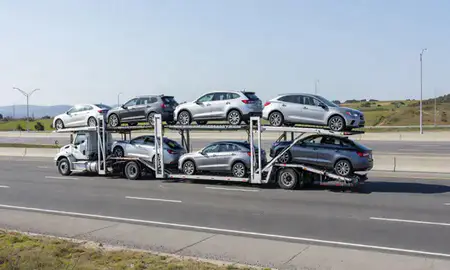 Multi-level car carrier on the highway to New London, Connecticut, United States