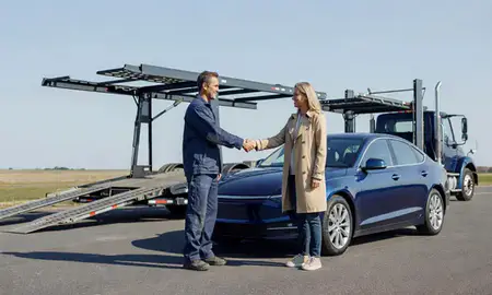 Vehicle owner beside their delivered car in New London, Connecticut, United States