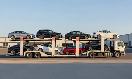 Car transporter parked in an industrial area of New London, Connecticut, United States