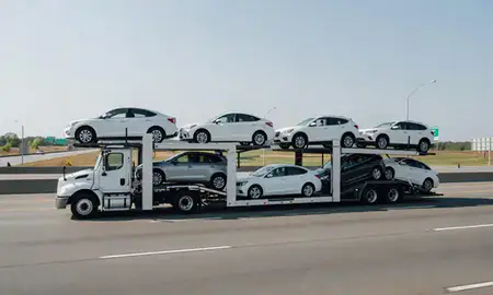 Multi-level car carrier on the highway to Norwalk, Connecticut, United States