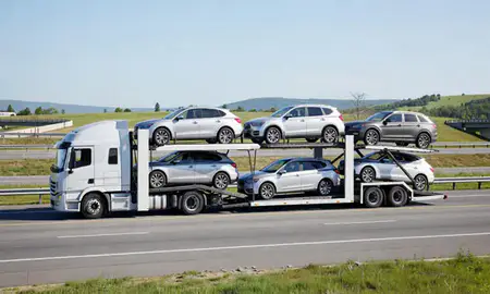 Multi-level car carrier on the highway to Norwich, Connecticut, United States