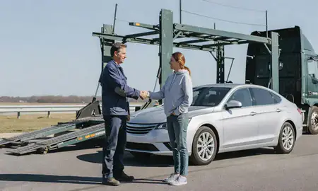 Vehicle owner beside their delivered car in Norwich, Connecticut, United States