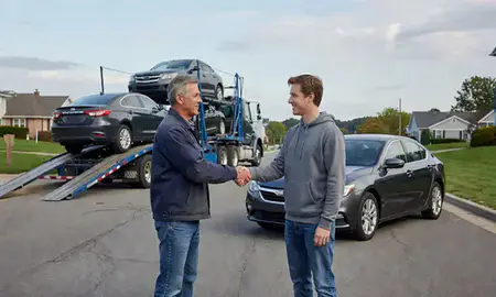 Vehicle owner beside their delivered car in Oakville, Connecticut, United States