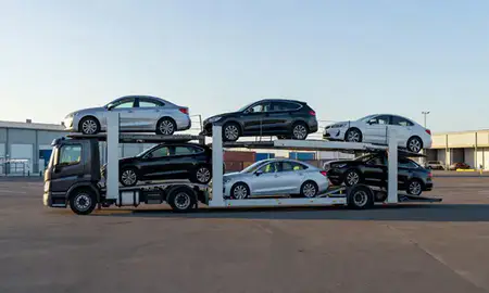 Car transporter loaded with vehicles in Riverside, Connecticut, United States