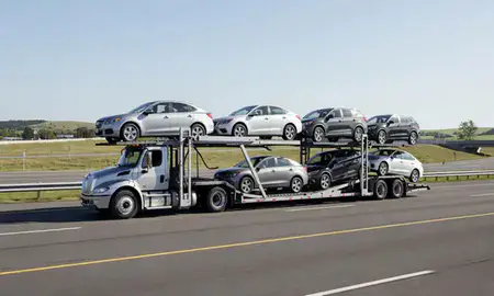 Multi-level car carrier on the highway to Sandy Hook, Connecticut, United States