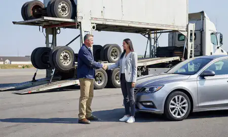 Vehicle owner beside their delivered car in Shelton, Connecticut, United States