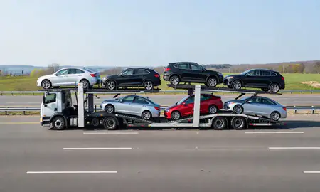Multi-level car carrier on the highway to Torrington, Connecticut, United States