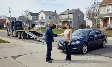 Vehicle owner beside their delivered car in Waterbury, Connecticut, United States