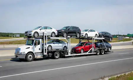Multi-level car carrier on the highway to West Haven, Connecticut, United States