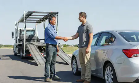 Vehicle owner beside their delivered car in Brookside, Delaware, United States