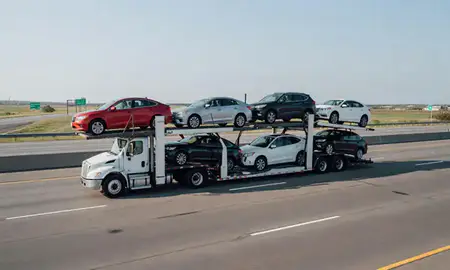 Multi-level car carrier on the highway to Camden, Delaware, United States