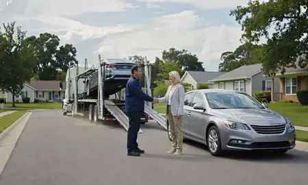 Vehicle owner beside their delivered car in Clayton, Delaware, United States