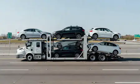 Multi-level car carrier on the highway to Elsmere, Delaware, United States