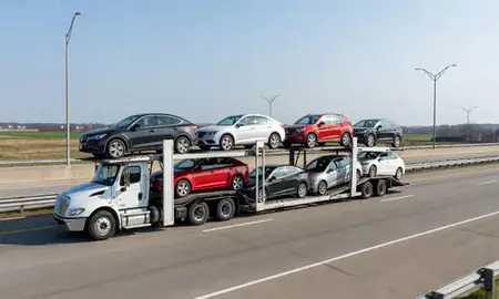 Multi-level car carrier on the highway to Glasgow, Delaware, United States