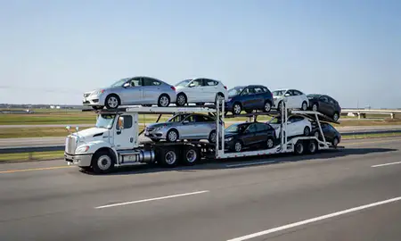 Multi-level car carrier on the highway to Harrington, Delaware, United States