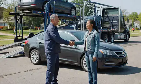 Vehicle owner beside their delivered car in Highland Acres, Delaware, United States
