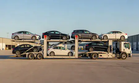 Car transporter parked in an industrial area of Highland Acres, Delaware, United States