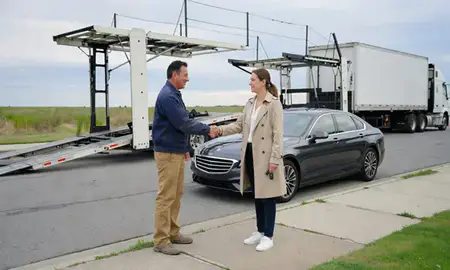 Vehicle owner beside their delivered car in Lewes, Delaware, United States
