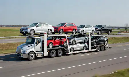 Multi-level car carrier on the highway to Milford, Delaware, United States