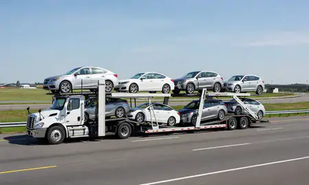 Multi-level car carrier on the highway to Milton, Delaware, United States