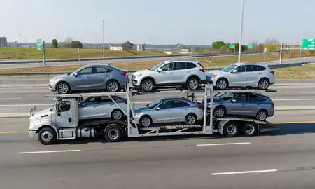Multi-level car carrier on the highway to Washington, District of Columbia, United States