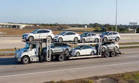 Multi-level car carrier on the highway to Bonita Springs, Florida, United States