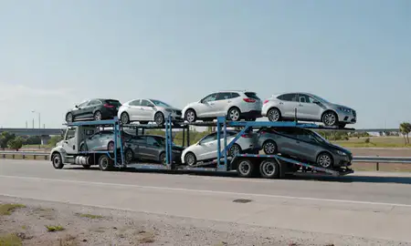 Multi-level car carrier on the highway to Brandon, Florida, United States