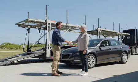 Vehicle owner beside their delivered car in Cape Coral, Florida, United States