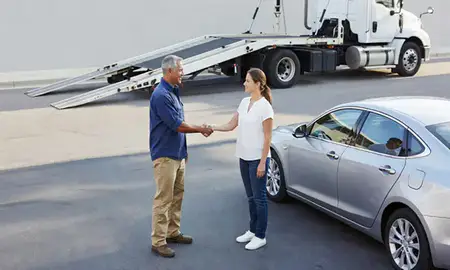 Vehicle owner beside their delivered car in Clearwater, Florida, United States