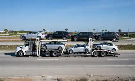 Multi-level car carrier on the highway to Deltona, Florida, United States