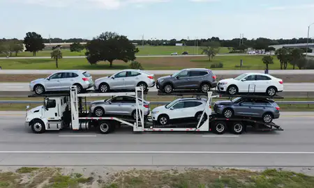 Multi-level car carrier on the highway to Gainesville, Florida, United States