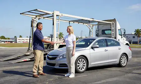 Vehicle owner beside their delivered car in Hialeah, Florida, United States