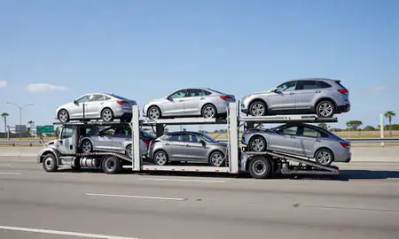 Multi-level car carrier on the highway to Hollywood, Florida, United States