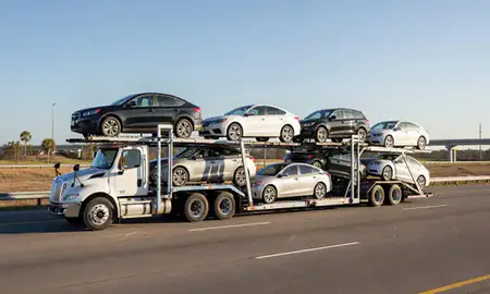 Multi-level car carrier on the highway to Jacksonville, Florida, United States