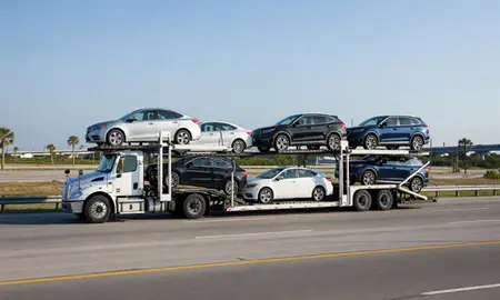 Multi-level car carrier on the highway to Kissimmee, Florida, United States