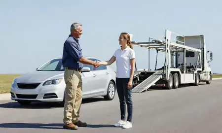 Vehicle owner beside their delivered car in Kissimmee, Florida, United States