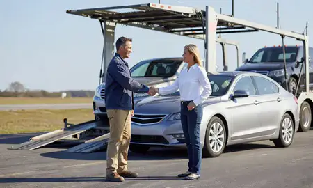 Vehicle owner beside their delivered car in Leesburg, Florida, United States