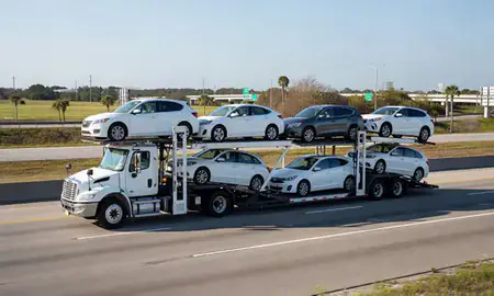 Multi-level car carrier on the highway to Orlando, Florida, United States