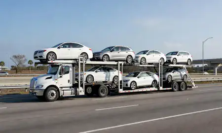 Multi-level car carrier on the highway to Palm Bay, Florida, United States