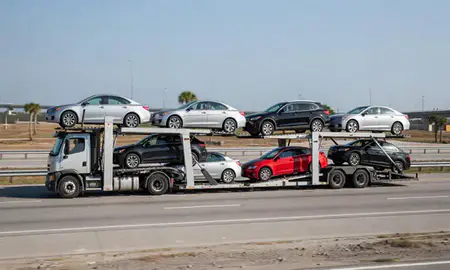 Multi-level car carrier on the highway to Pensacola, Florida, United States