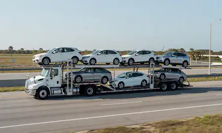 Multi-level car carrier on the highway to Port St. Lucie, Florida, United States