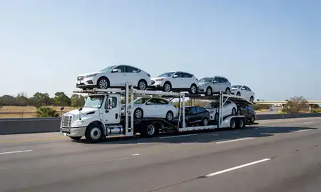 Multi-level car carrier on the highway to Spring Hill, Florida, United States