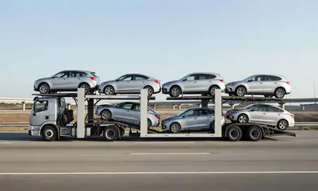Multi-level car carrier on the highway to St. Petersburg, Florida, United States