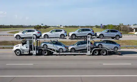Multi-level car carrier on the highway to Tallahassee, Florida, United States