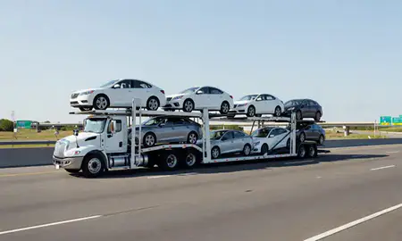 Multi-level car carrier on the highway to Georgia, United States