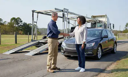 Vehicle owner beside their delivered car in Georgia, United States
