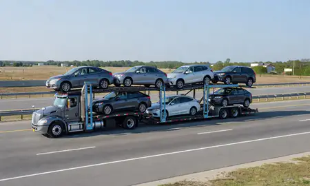 Multi-level car carrier on the highway to Albany, Georgia, United States