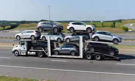 Multi-level car carrier on the highway to Alpharetta, Georgia, United States