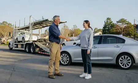 Vehicle owner beside their delivered car in Athens, Georgia, United States