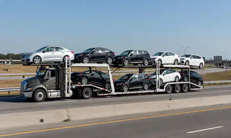 Multi-level car carrier on the highway to Augusta, Georgia, United States